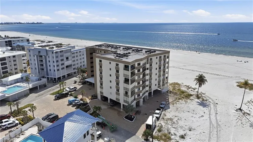 Aerial view of expansive coastline and apartment complex