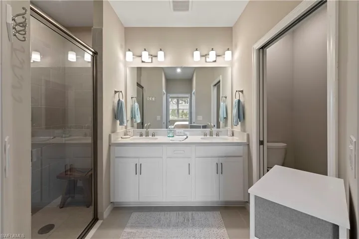 Spacious bathroom featuring a tiled, walk-in shower.