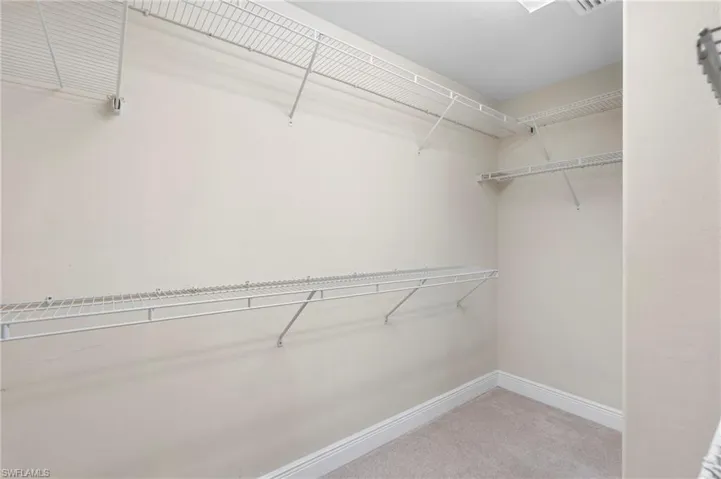 Walk-in closet in primary bedroom