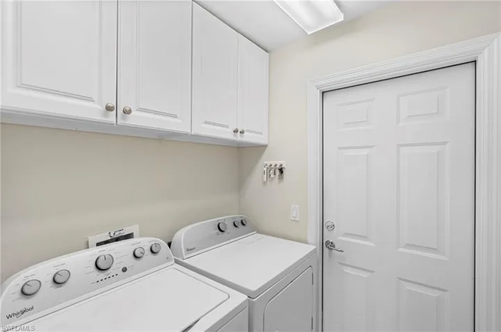 Laundry room with cabinets