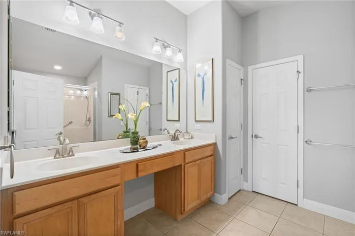 Dual vanity with linen closet
