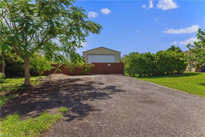 Garage featuring a yard