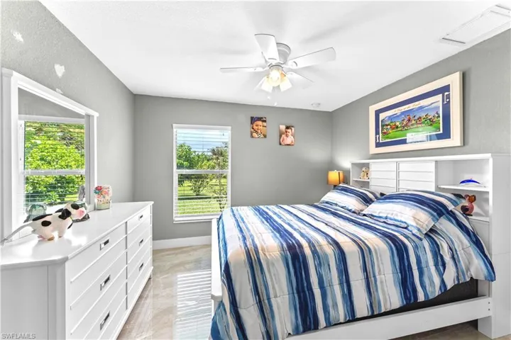 Bedroom featuring a textured ceiling and ceiling fan