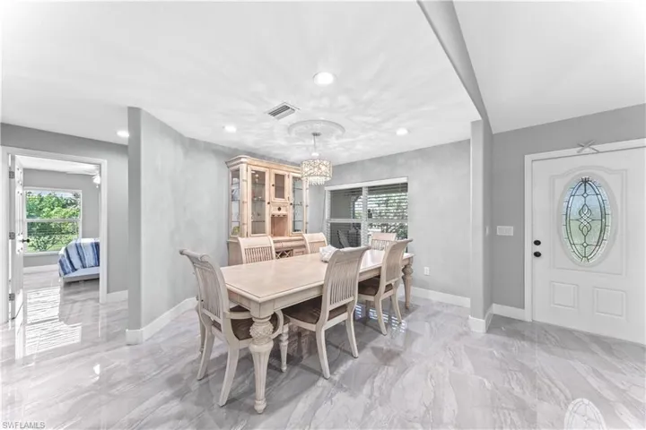 Dining area with an inviting chandelier