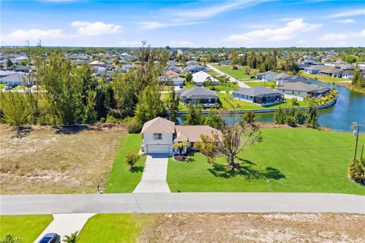 The serene freshwater canal in the background sets the stage for a quintessential Florida lifestyle—your perfect retreat begins the moment you arrive.