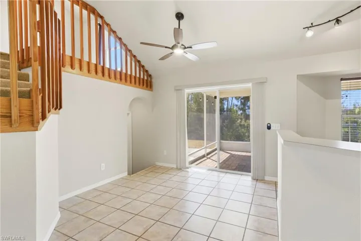 Sunlit dining room with stylish finishes and connection to the kitchen and family room, ideal for hosting dinners or enjoying quiet meals with loved ones.