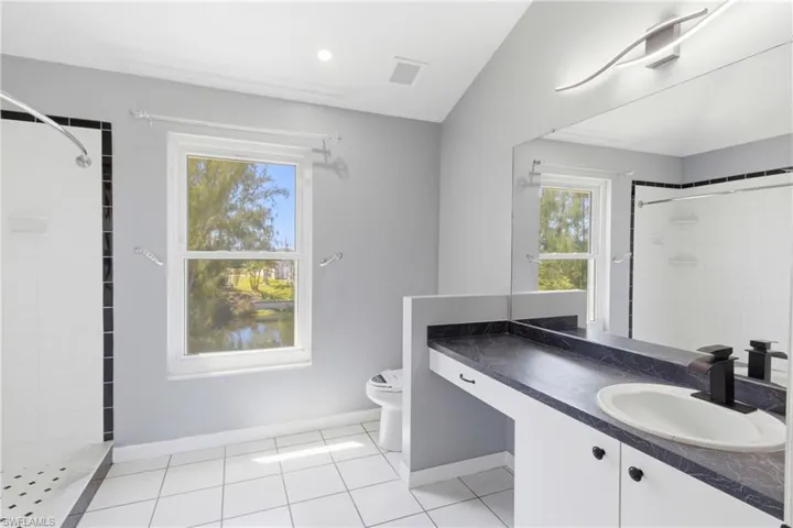 A bright and functional space designed for everyday ease, complementing the comfort of your private suite with a huge walk-in shower.