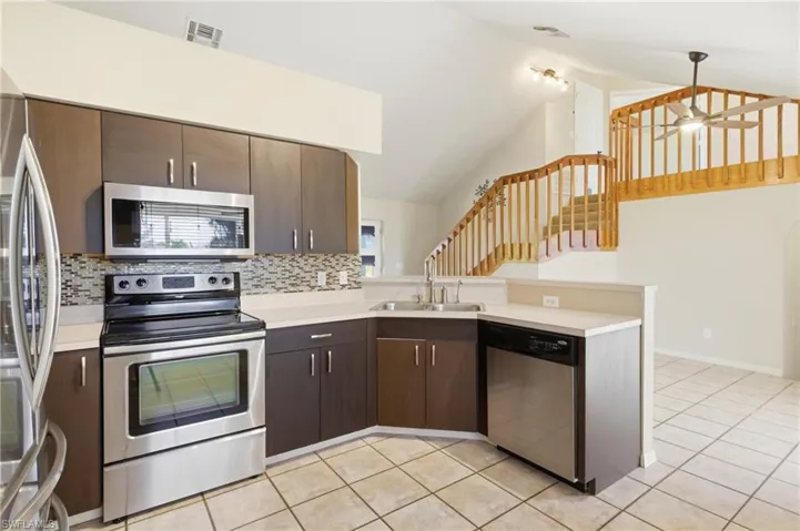 Chef-inspired kitchen with clean lines, functional layout, and open access to dining and living spaces, offering a perfect blend of style and practicality.