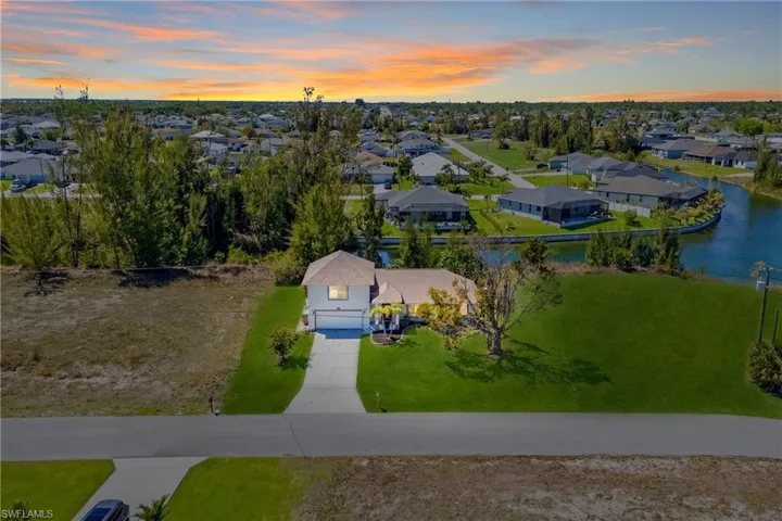 A truly unforgettable moment—vibrant sunset colors reflecting across the canal, creating a peaceful, picture-perfect ending to every day in your new home.