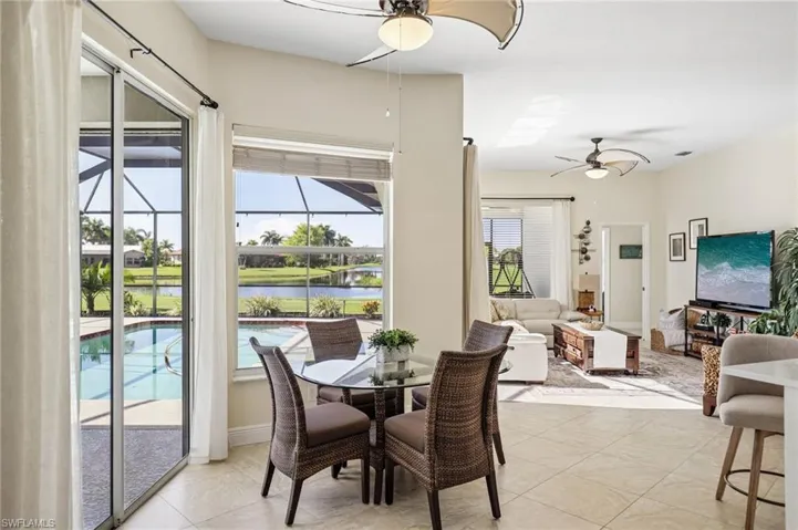 Sliding Glass Doors and Windows Line the Entire Great Room -Offering a Panoramic Backdrop of Water and Golf Course Vistas