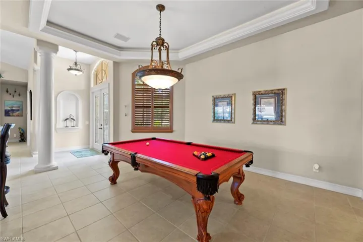 Dining area, currently used for a game of pool