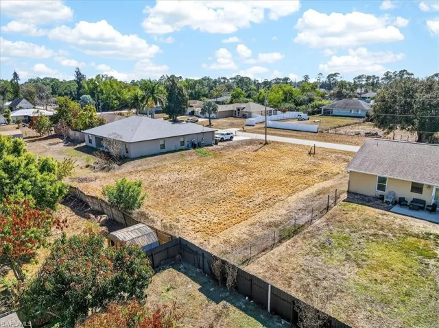 Aerial view of residential area with a tree filled landscape
