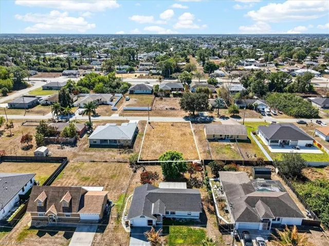 View of property location with nearby suburban area