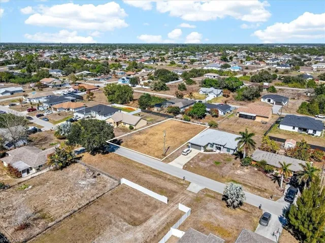 View of property location with nearby suburban area