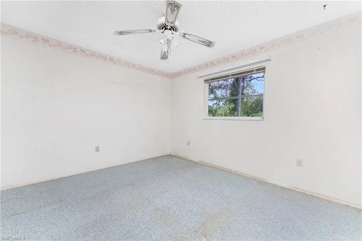 Kitchen with sink, appliances with stainless steel finishes, ceiling fan, and hardwood / wood-style floors