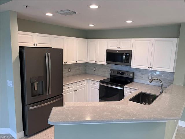 Updated Kitchen with no fingerprint appliances and beautiful backsplash