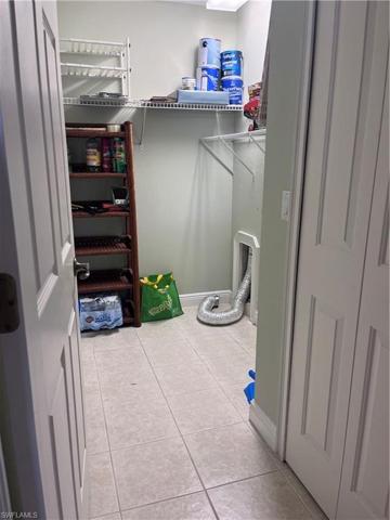 Laundry room with additional storage