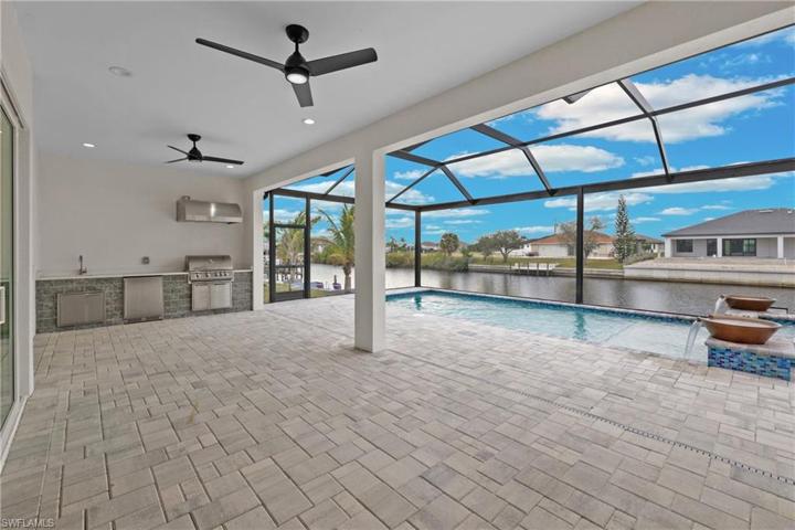 Huge lanai and summer kitchen with heated pool and spa
