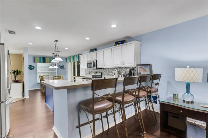 Open-concept kitchen with wood-finish flooring