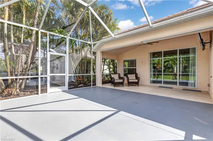 Unfurnished sunroom featuring ceiling fan