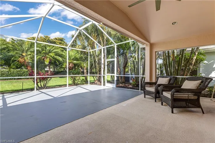 View of patio / terrace with ceiling fan and glass enclosure