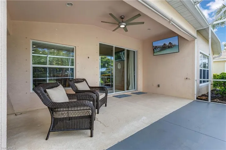 View of patio featuring ceiling fan
