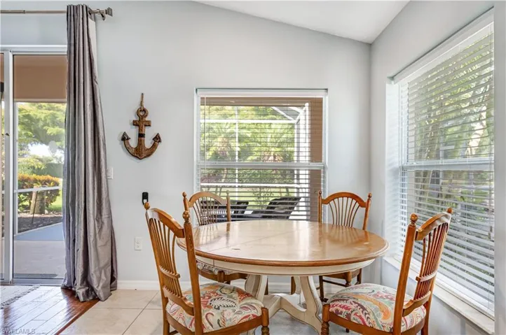Dining space featuring plenty of natural light and baseboards
