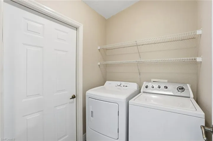 Laundry room featuring washer and clothes dryer