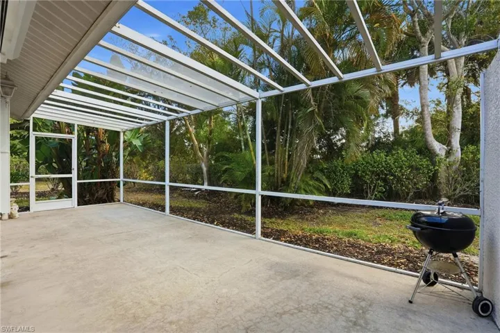 Unfurnished sunroom featuring a patio and healthy amount of natural light