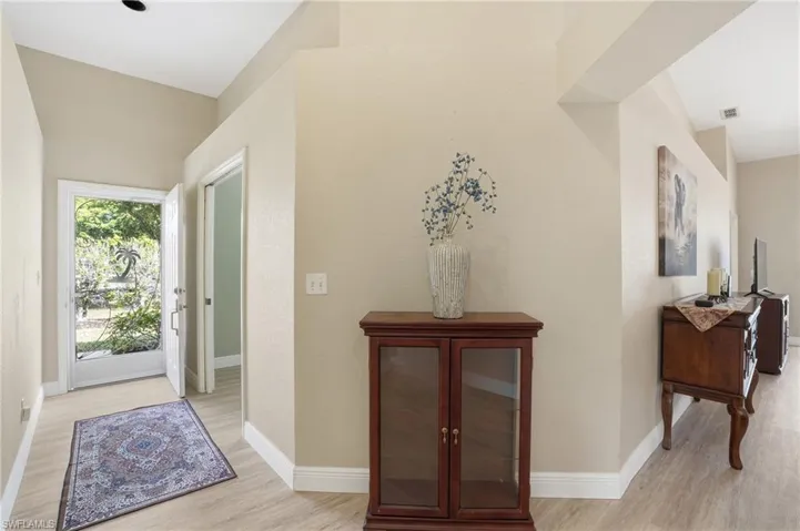 The newly installed and neutral luxury vinyl creates a seamless and expansive space throughout