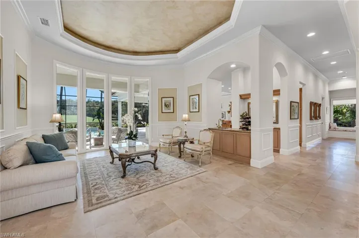 This residence boasts of high ceilings and amazing views from almost every room in the home, beginning with the entry and formal living room.