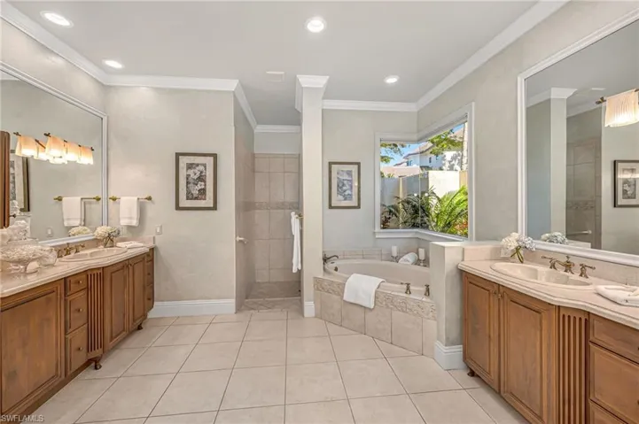 The primary bath has double vanities and abundant storage.