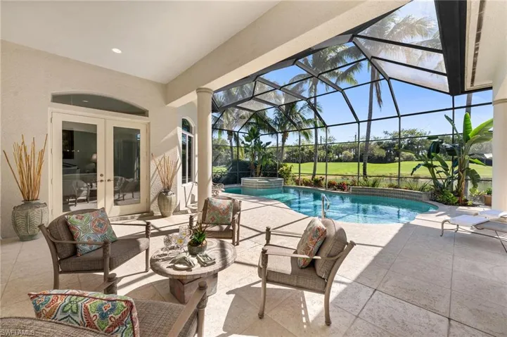This residence has a lot of covered, exterior space, and here is the perfect spot for a morning coffee to begin your day.  This could also be the perfect spot to add a fire pit!