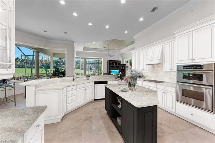This is what your new kitchen could look like, with some paint and Taj Mahal counters and backsplash!  The floors are neutral marble, so the Taj Mahal would be a wonderful compliment!