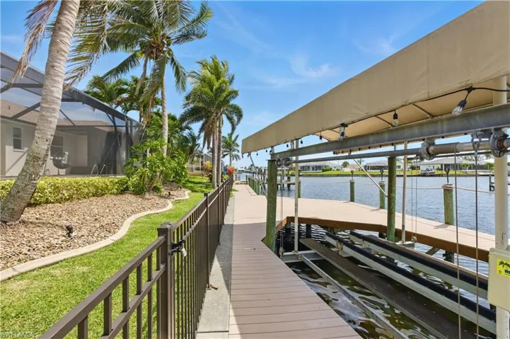 Dock with boat lift, and a water view