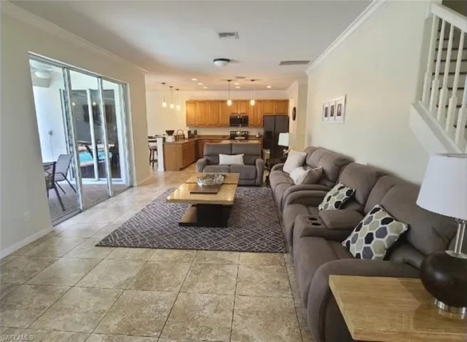 Living room featuring ornamental molding