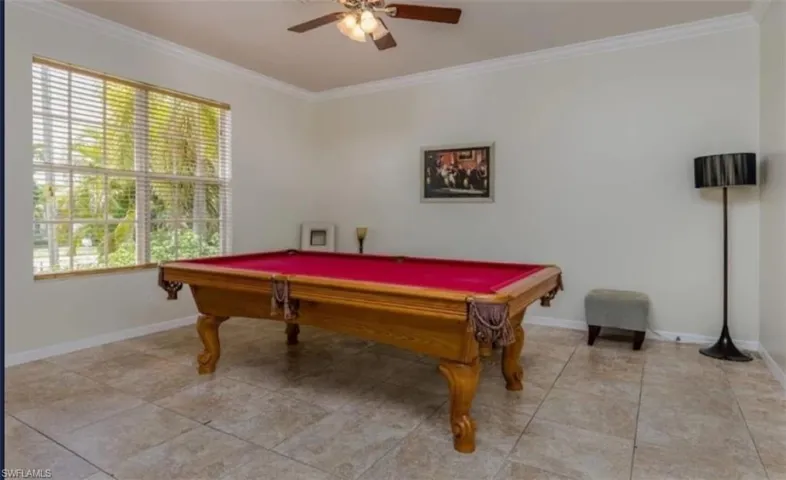 Playroom with billiards, plenty of natural light, and ceiling fan