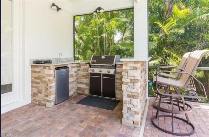 View of patio / terrace featuring exterior kitchen, grilling area, and sink
