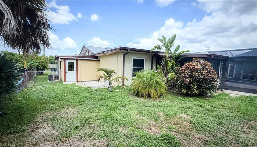 Rear view of property featuring stucco siding
