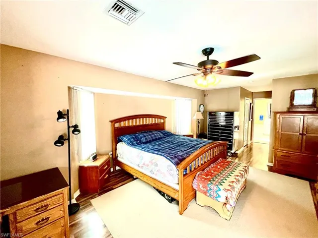 Bedroom featuring light hardwood / wood-style floors and ceiling fan