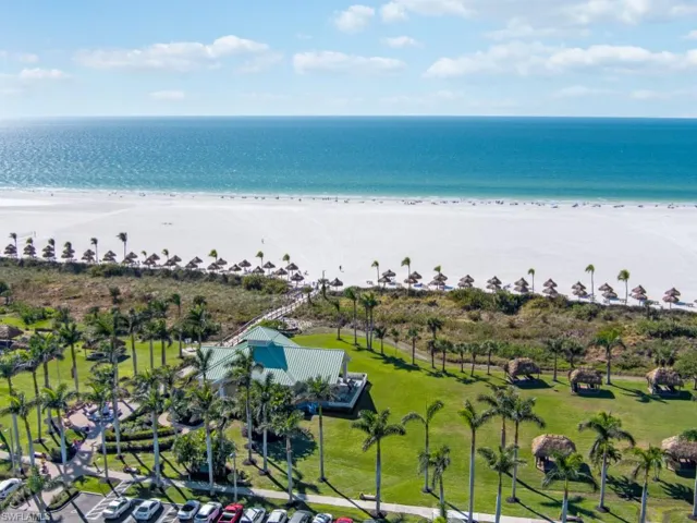 Drone / aerial view with a view of the beach and a water view