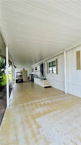 LEFT SIDE CARPORT WITH ATTACHED STORAGE