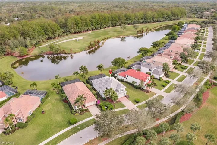 Aerial view of home, water, & golf course