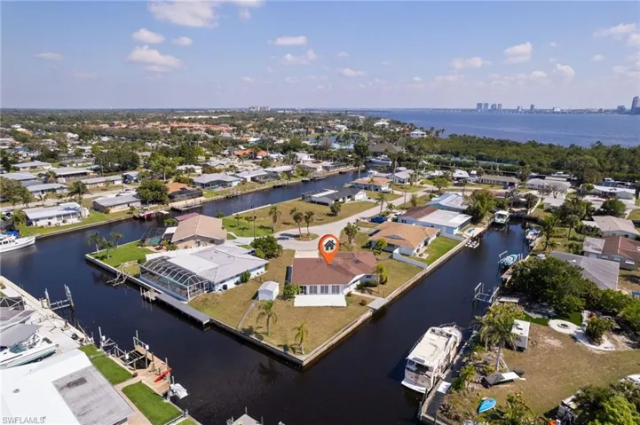 Aerial view featuring a water view and a residential view