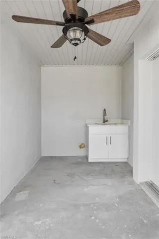 Out door lanai with ceiling fan and sink