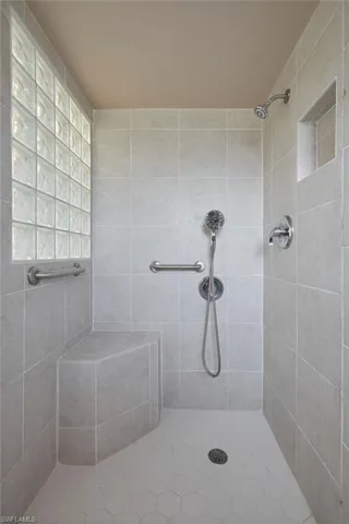 Bathroom featuring a tile shower