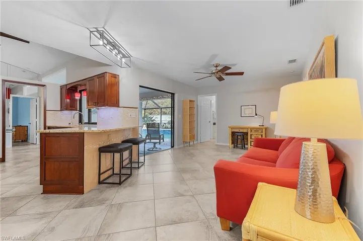 Family room also walks out to lanai/pool with pool bath