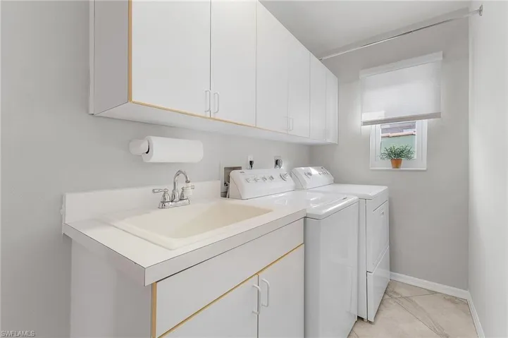 HUGE laundry room walks out to HUGE garage