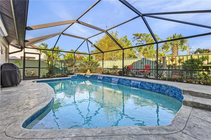 Beautiful landscaped private backyard with pool and hobby room