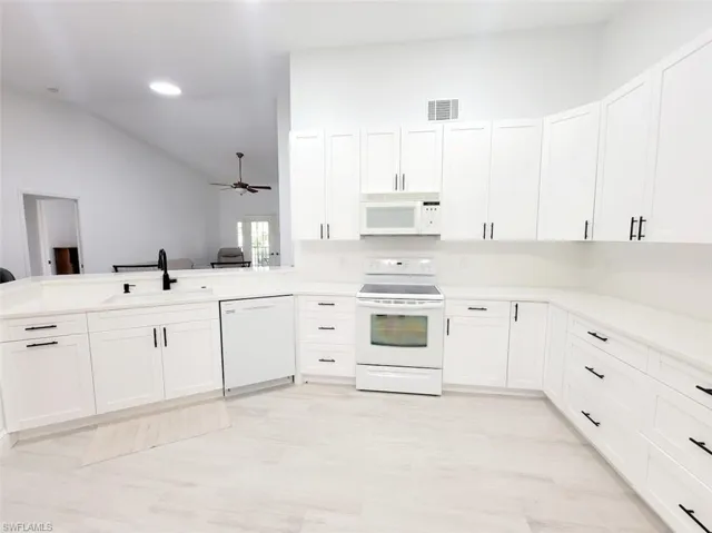 Kitchen Open to the Family Room - View #1